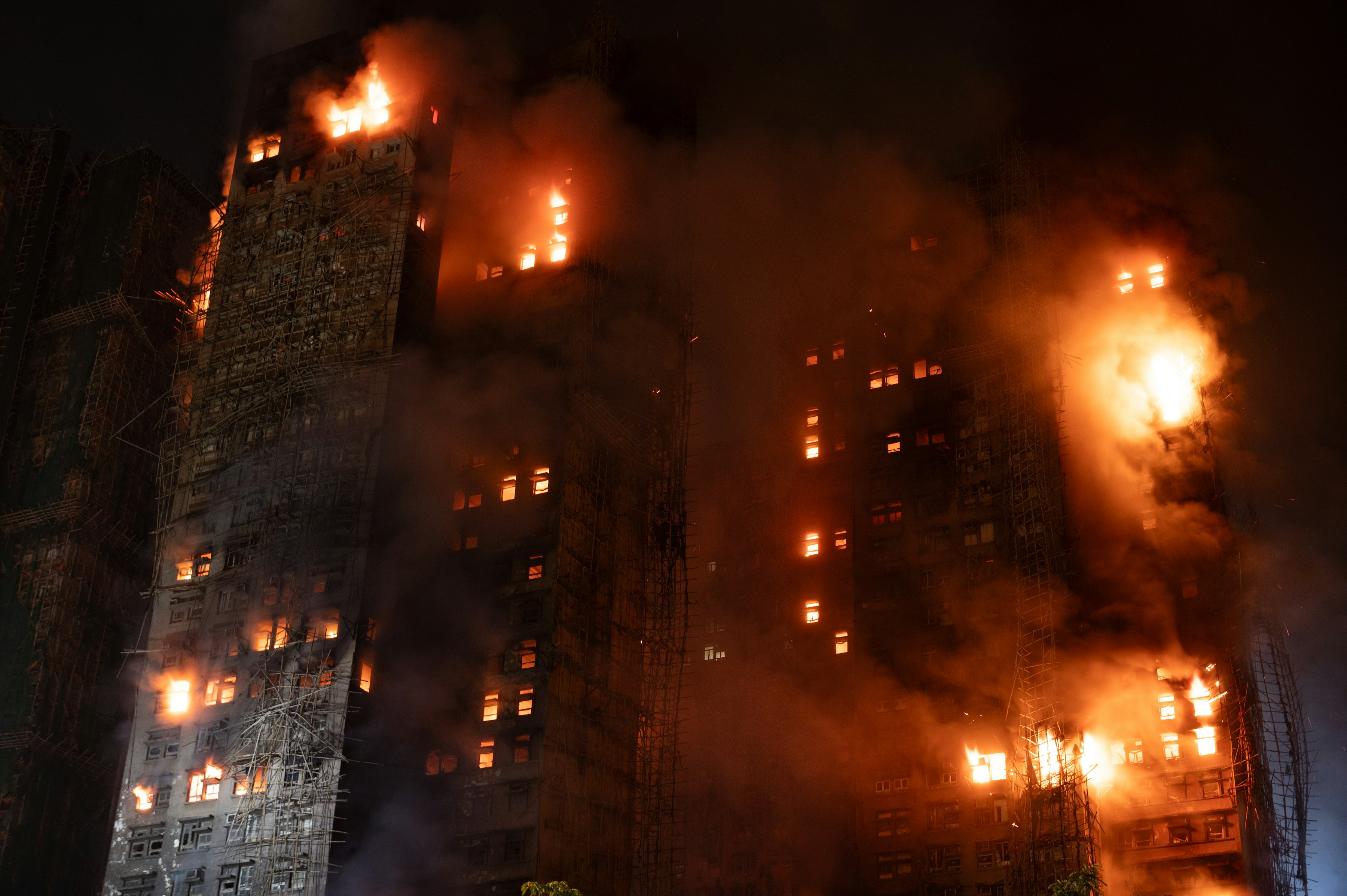 Building engulfed in flames at night